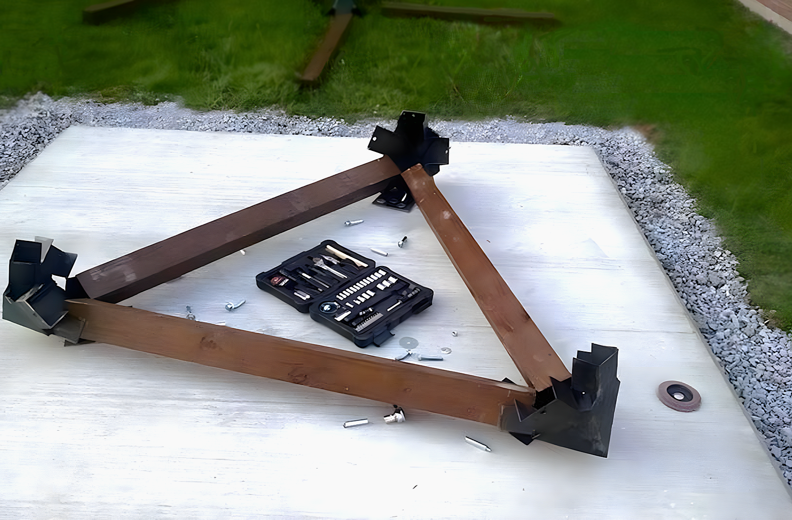 The scultpure's base secured to the cement pad